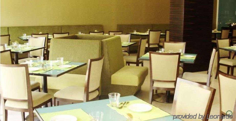 فندق بنغالورفي  رادها ريجنت إلكترونيك سيتي المطعم الصورة